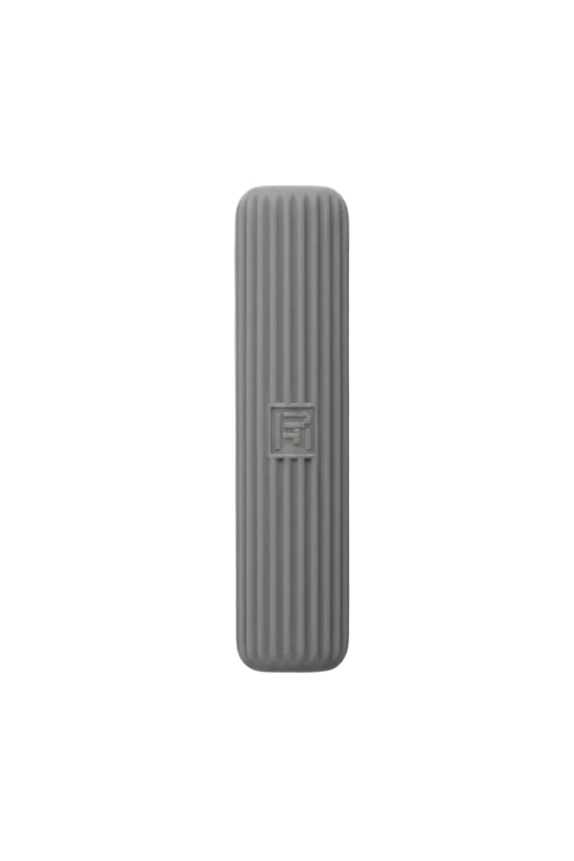 Gray sponge with a textured surface on a white background